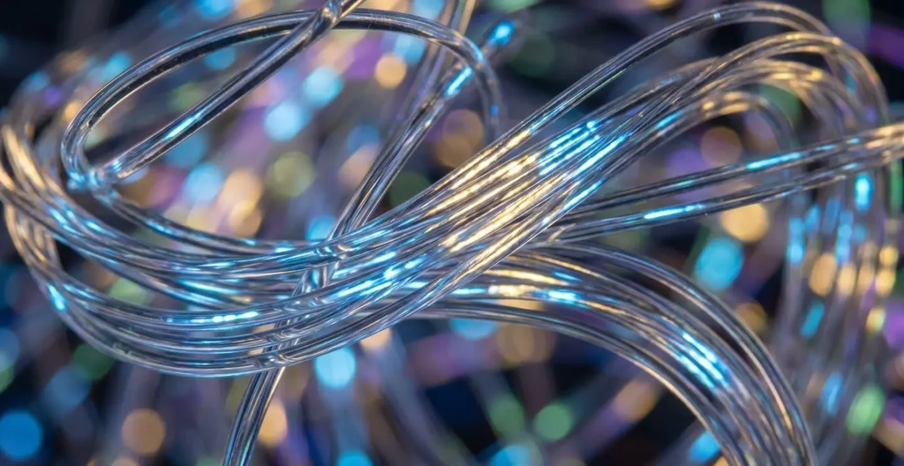 Extreme close-up of fiber optic cables showing data transmission patterns